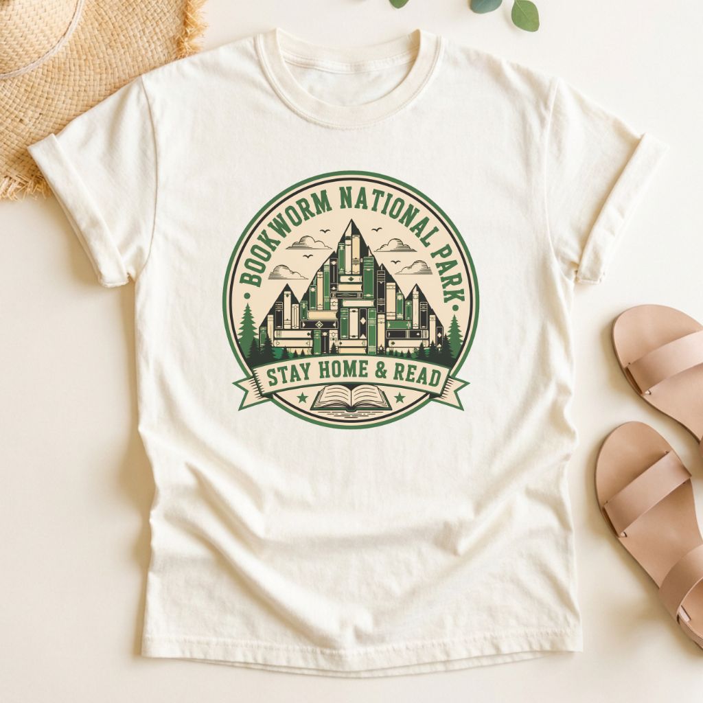 Ivory t-shirt with green 'Bookworm National Park' graphic on a light surface.